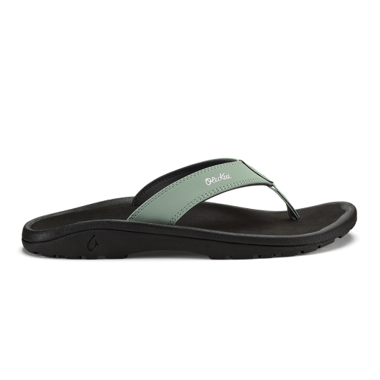Seagreen and black thong sandal with cushioned sole and curved footbed.